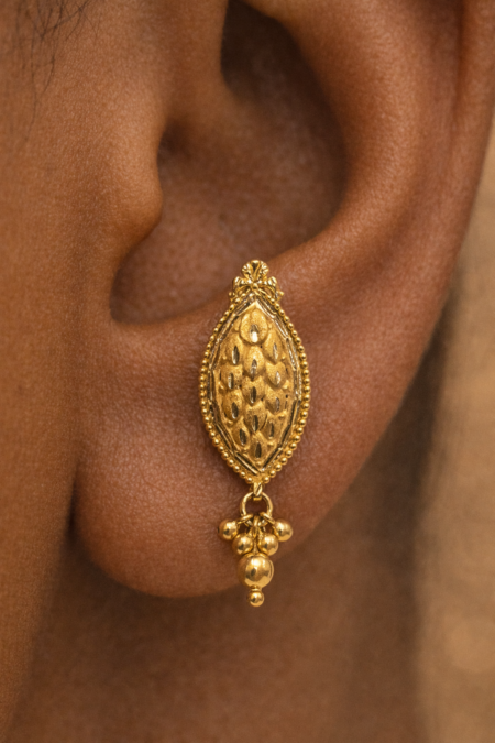 Handmade 22K gold leaf stud earrings close-up Pure 22K solid gold leaf earrings for women Minimal leaf drop design 22K gold stud earrings