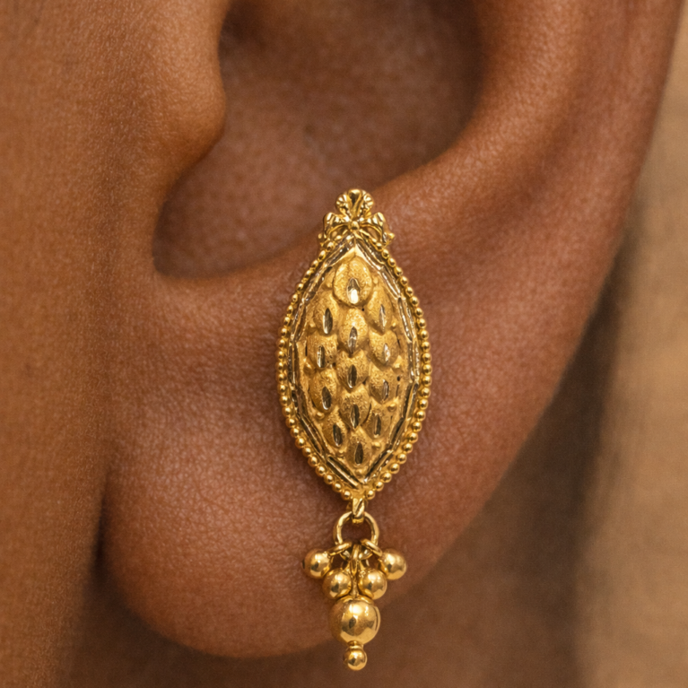 Handmade 22K gold leaf stud earrings close-up Pure 22K solid gold leaf earrings for women Minimal leaf drop design 22K gold stud earrings