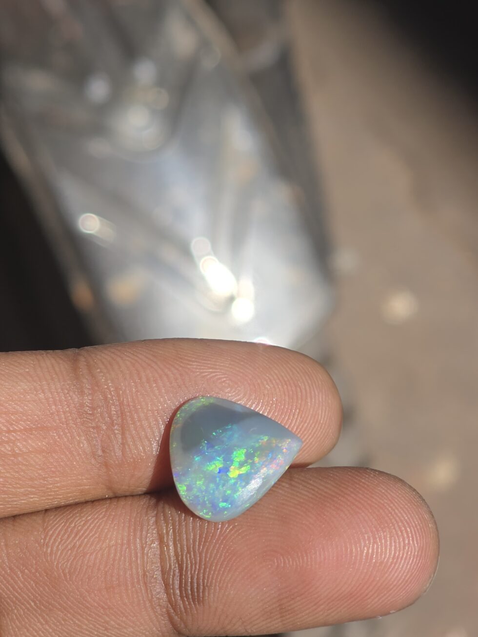 Natural Australian opal pear shape cabochon gemstone with blue green fire