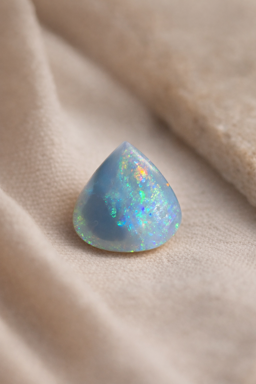 Natural Australian opal pear shape cabochon gemstone with blue green fire
